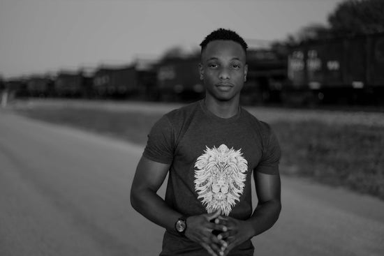 Young man wearing an ELI-BY-NOK lion face t-shirt.  We believe you should rock your style.